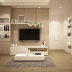 Moderne ideale tv-wand met minimalistisch design, neutrale kleuren en ingebouwde opbergruimte in een stijlvolle woonkamer.
